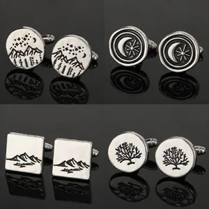Detailed view of exquisite silver metal cufflinks featuring nature and tree designs for shirts.