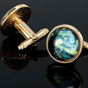 Detail shot of golden metal cufflinks featuring starry night art glass dome, polished finish.