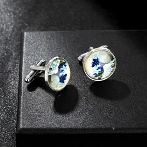 Detail view of round silver-tone metal cufflinks featuring the famous Great Wave art print design.