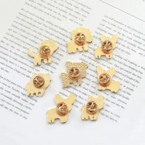 Detailed view of cute metal dog enamel pins featuring corgi and teddy designs for backpacks.