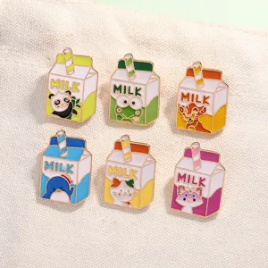 Cute cartoon milk carton enamel pins set, colorful metal brooch badges for denim jackets and bags.