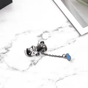 Creative cartoon animal metal chain brooch with a small fish pendant, cute fashion jewelry detail.