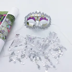 Silver sequin masquerade mask with veil and tassel fringe for party and Halloween costume.