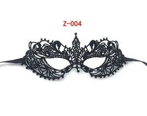 Black lace masquerade mask detail view, showing delicate patterns and secure ribbon ties.