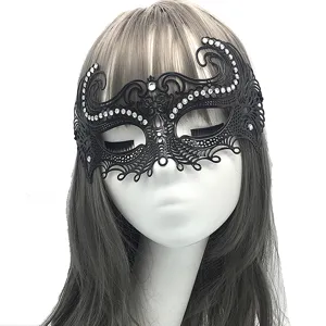 Venetian masquerade mask detailed view showing black metal patterns and rhinestones.