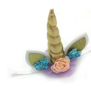Kids unicorn headband with gold horn and floral details for birthday party hair accessory