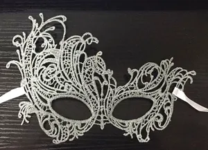 Silver lace masquerade mask detail view, elegant hollow out design for party costume events.