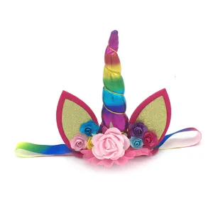 Detailed shot of kids unicorn birthday party headband with rainbow horn and glitter ears detail.
