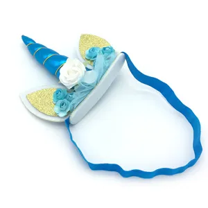 Kids blue unicorn headband with gold glitter ears, flowers and elastic band for birthday party.