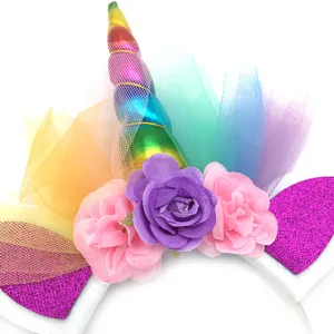 Unicorn headband detail featuring colorful horn, fluffy tulle, and vibrant fabric flowers.