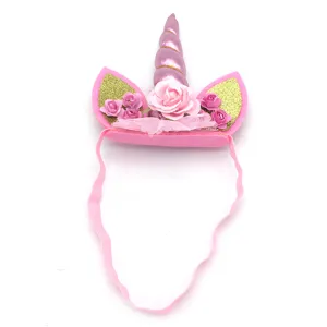 Kids unicorn headband birthday party hair hoop with gold horn, glitter ears, and pink roses.