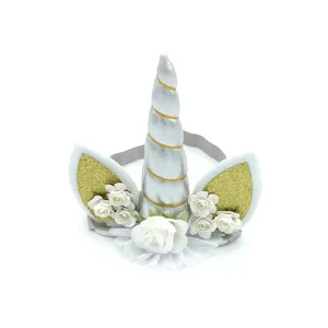 Details of cute unicorn headband with silver horn, gold glitter ears and white roses for kids.