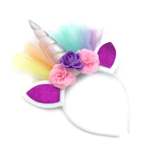 Detailed view of colorful unicorn headband with silver horn, floral decor and glitter ears.