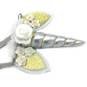 Kids unicorn headband party hair accessory with silver horn, gold glitter ears and white roses.