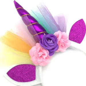 Close-up detail of the cute unicorn horn headband with colorful tulle and floral decor.