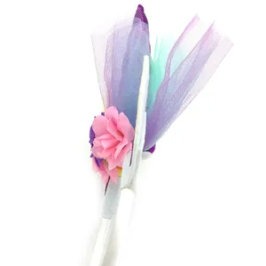 Detailed close-up view of unicorn headband featuring colorful tulle netting and pink flower details.