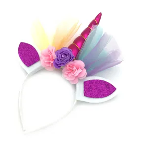 Unicorn birthday party headband with glitter ears, colorful tulle and flowers for girls.