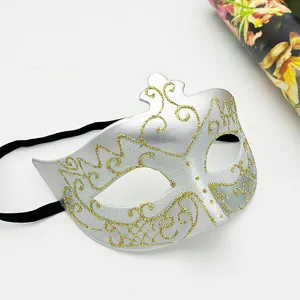 Detailed view of the silver masquerade eye mask with shiny gold glitter design for party props.