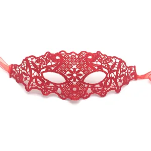 Red lace half face mask detail showing intricate floral patterns and soft ribbon ties for parties.