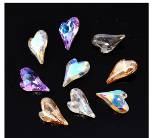 Close-up shot showing asymmetrical heart crystal rhinestones for stunning nail art designs.