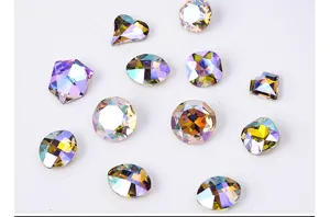 Close-up detail of iridescent crystal rhinestones, mixed shapes colorful flatback gems.