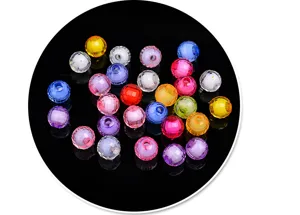 Close-up detail of colorful acrylic faceted round beads for DIY jewelry making crafts.