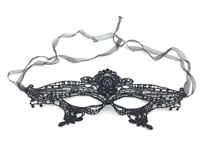 Black lace masquerade mask detail view, elegant half face eye mask for party and Halloween costume.