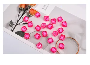Pink acrylic faceted cube beads for DIY children's handmade jewelry crafting and beading projects.