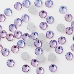 Close-up detail of sparkling purple flatback rhinestones for nail art and DIY crafts.