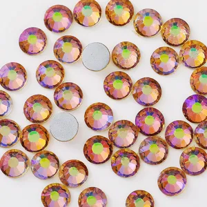 Close-up detail of colorful flatback glass rhinestones for DIY nail art and phone decoration.