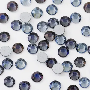 Detail shot of sparkling dark blue glass flatback rhinestones, perfect for DIY nail art and phone decor.