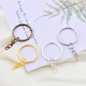 Metal DIY keychain rings with extension chain in gold, silver, and bronze colors for crafts.