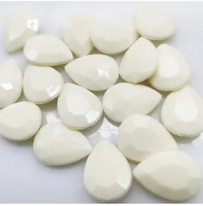 Teardrop acrylic rhinestone flatbacks in creamy white, multi-faceted craft gems for DIY phone cases.