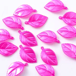 Hot pink leaf charms for DIY jewelry making, detailed view of vibrant resin leaf pendants accessories.