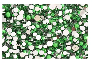 Mixed size 2-5mm green flatback resin rhinestones for DIY nail art phone case decor detail.