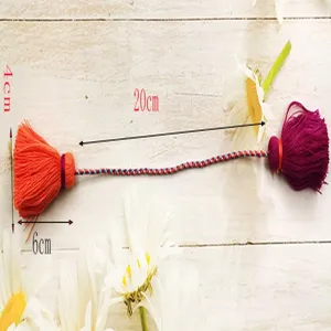 Detail view of double-ended color-blocking Chinese style tassel pendant with dimension marks.