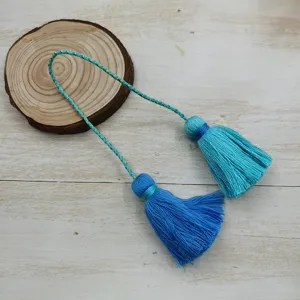 Detail of double blue tassel hanging ornament for Hanfu and traditional Chinese decor.