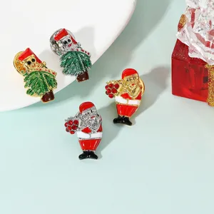 Close up of Christmas brooch details, featuring sparkling crystal rhinestones on Santa and tree.
