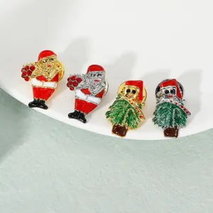Detailed close-up shot of Christmas rhinestone brooch pins featuring Santa and trees.