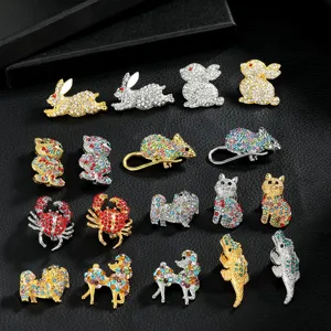 Close-up detail view of assorted crystal rhinestone animal brooches, sparkling lapel pins.