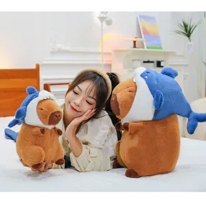 Cute capybara plush toy with blue shark hat soft stuffed animal doll for kids birthday gifts.