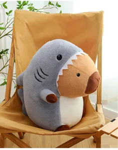 Cute shark capybara plush toy detail, soft stuffed animal pillow for sleeping and home decor.