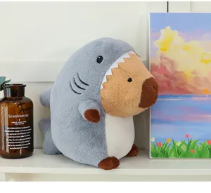 Detail view of cute shark capybara plush toy, soft stuffed animal pillow for kids and gift.