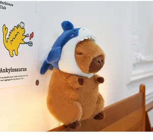 Cute capybara plush toy wearing a funny shark hat soft stuffed animal gift for children.