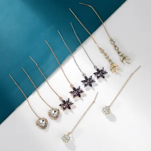 Long tassel dangle earrings featuring sparkling rhinestones, elegant flower and heart designs.