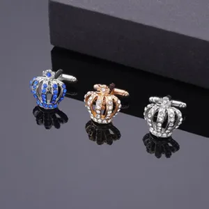 Detailed view of men's crown cufflinks with sparkling rhinestones in three elegant colors.