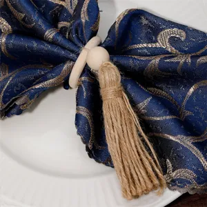 Wooden beaded tassel napkin ring with natural jute rope, rustic table decoration.