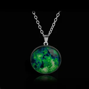 Detailed shot of the luminous green starry sky glass gemstone pendant necklace on chain.