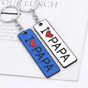 Set di portachiavi con lettere bifacciali creativo con targhette metalliche blu e bianche.