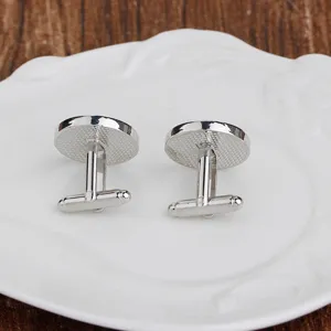 Classic silver tone metal men shirt cufflinks with bullet back closure detail display.